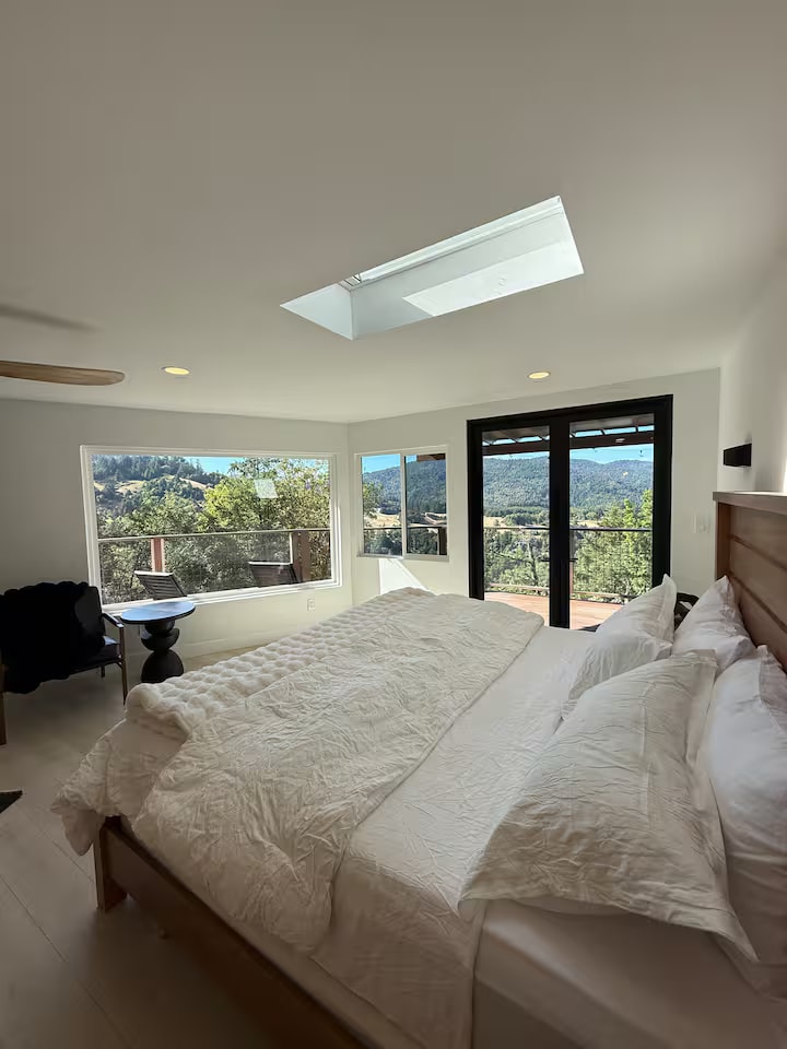 Cliff House bedroom with deck access and mountain views